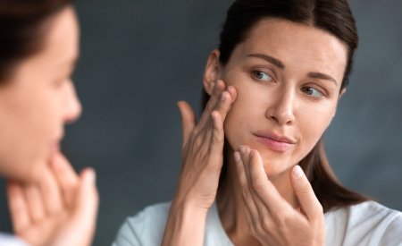 sebium_maskne-women-checking-acne-mirror