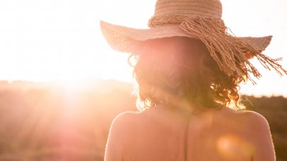 Back of a woman under the sun